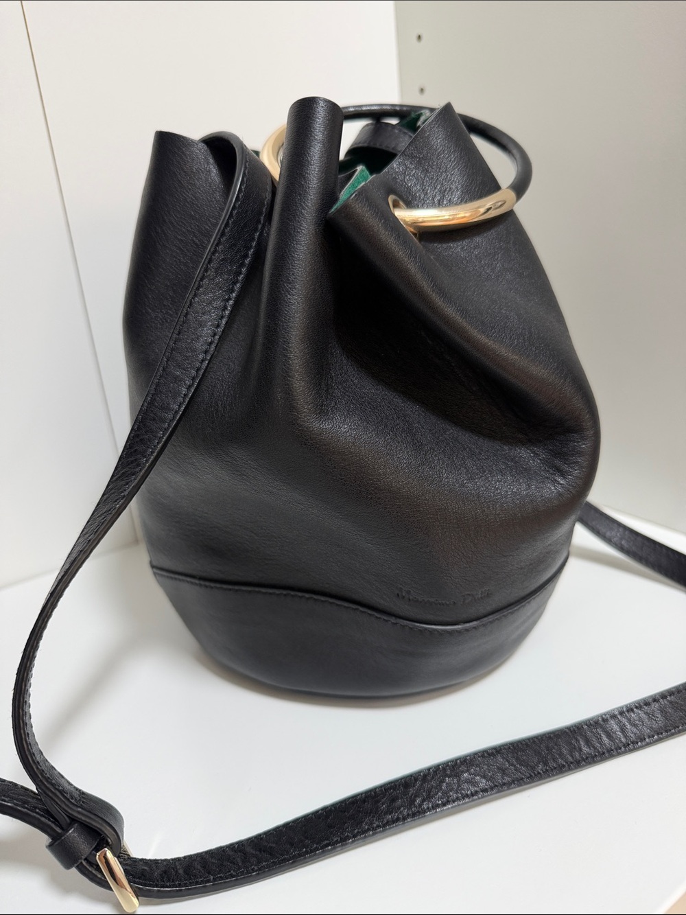 Black Leather Bucket Bag with Gold Ring Accent